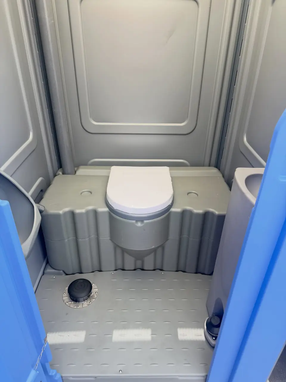 Wide open floor inside a portable toilet